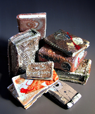 Adil Writer is an "architect-turned-potter" from Bombay. His studio, Mandala Pottery, is in the international community of Auroville in south India, where he with his three partners form a production unit making functional ceramic-ware, large scale ceramic murals, etc. Adil's "studio ceramic" work is stoneware wood-fired to cone 10. The red dot often featured in his work is inspired by street architecture and roadside shrines of south India..... where installation art is practiced daily.... and innocuously... by simple people, "with faith in their hearts and a light in their eyes."